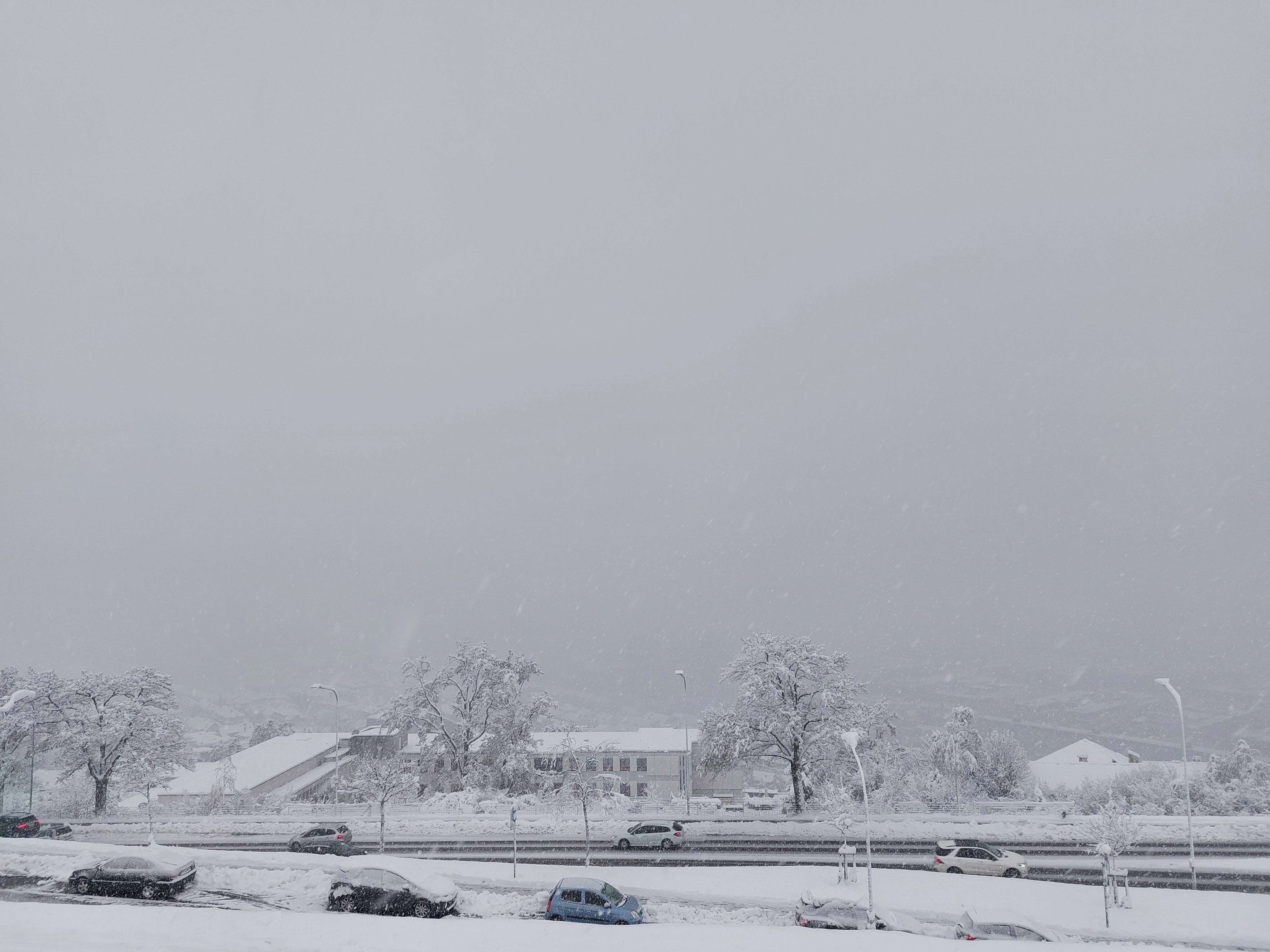 Downtown Zürich and alps in snowstorm, no visibility