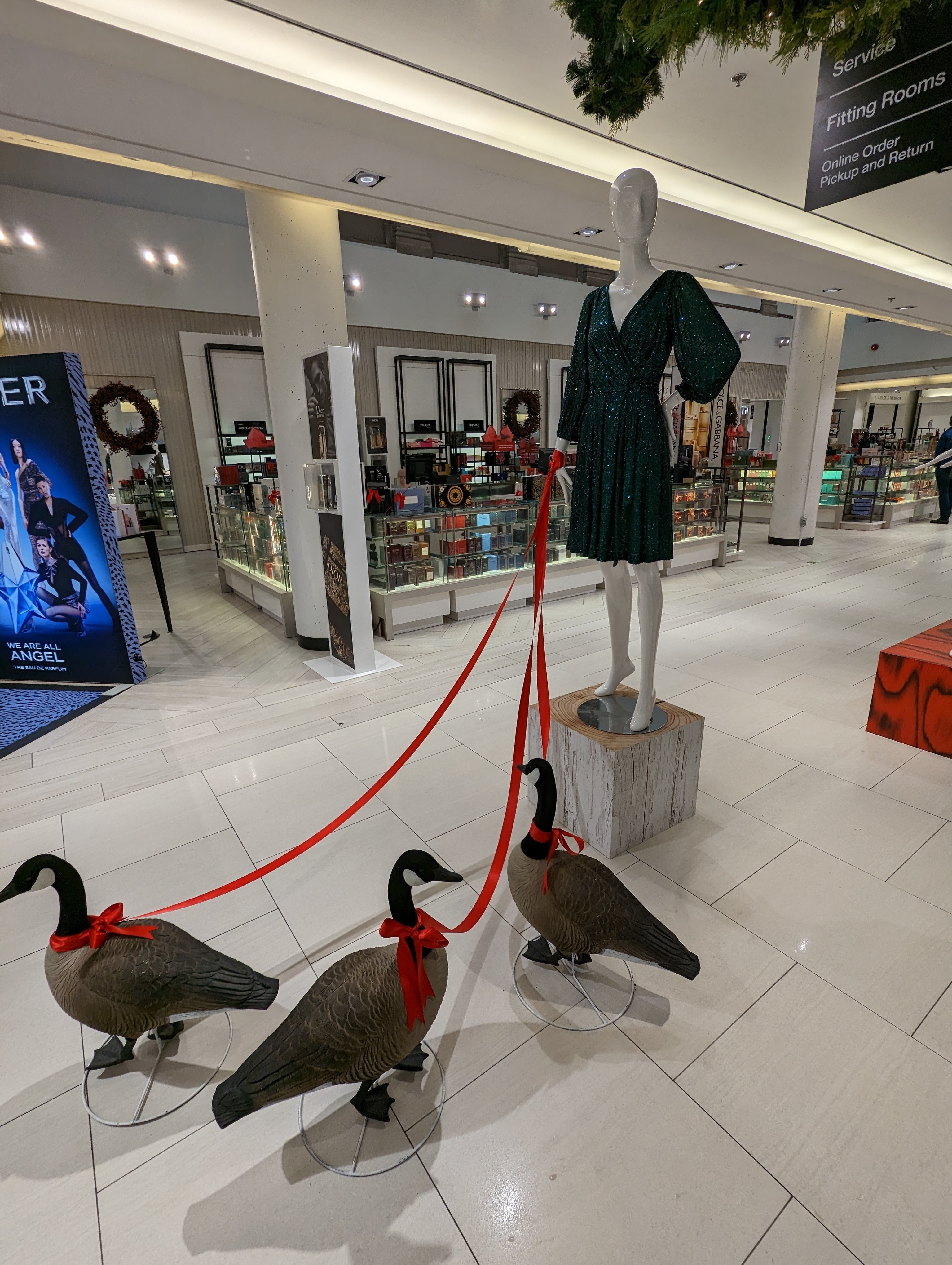 Mannequin holding geese