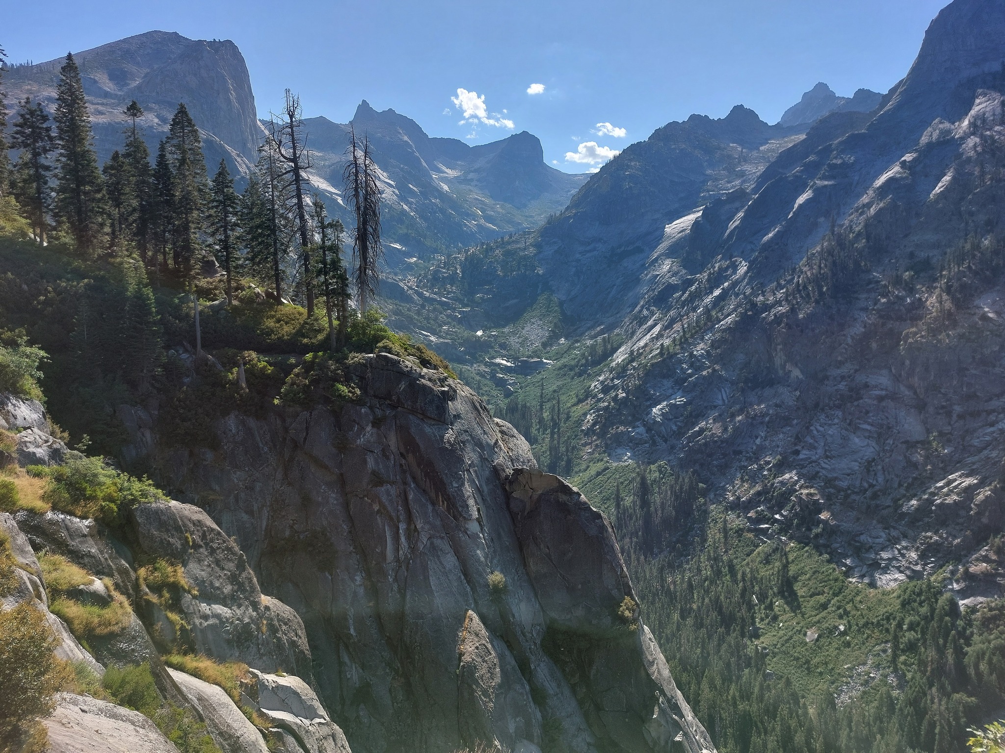 Cliff face with mountains behind